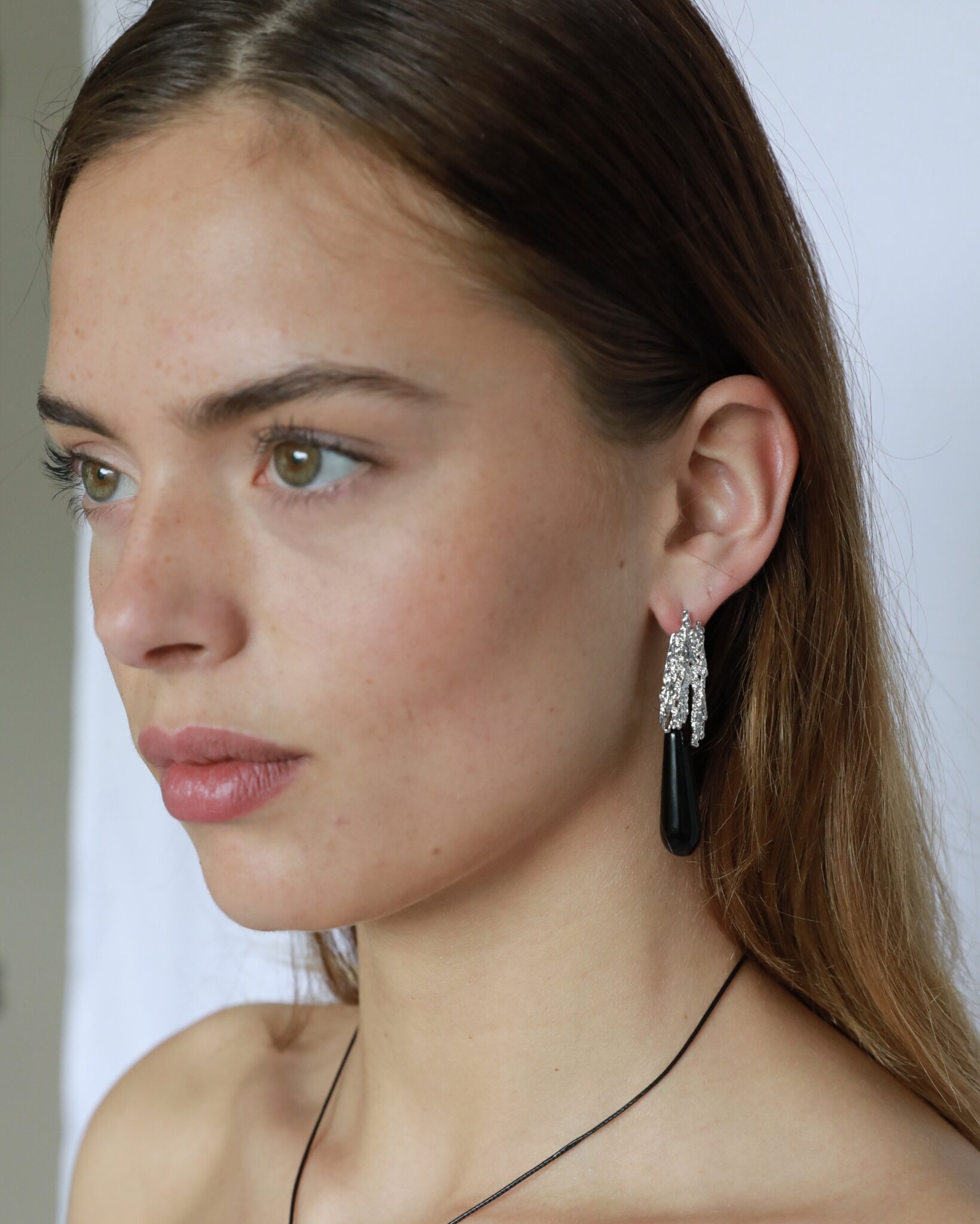 Natural black onyx teardrop earrings with textured silver-plated brass