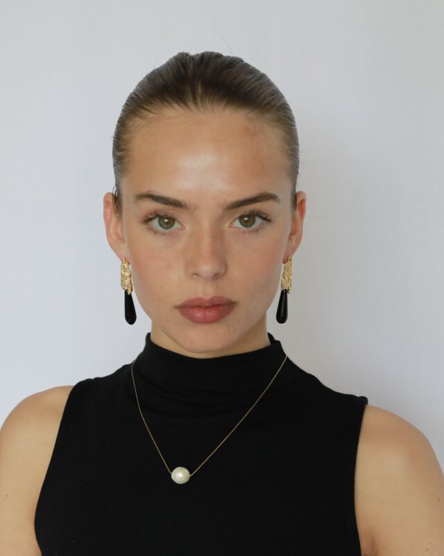 Natural black onyx teardrop earrings with textured gold-plated brass model